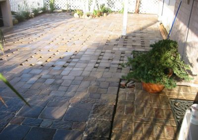 Paved patio with salvaged bricks